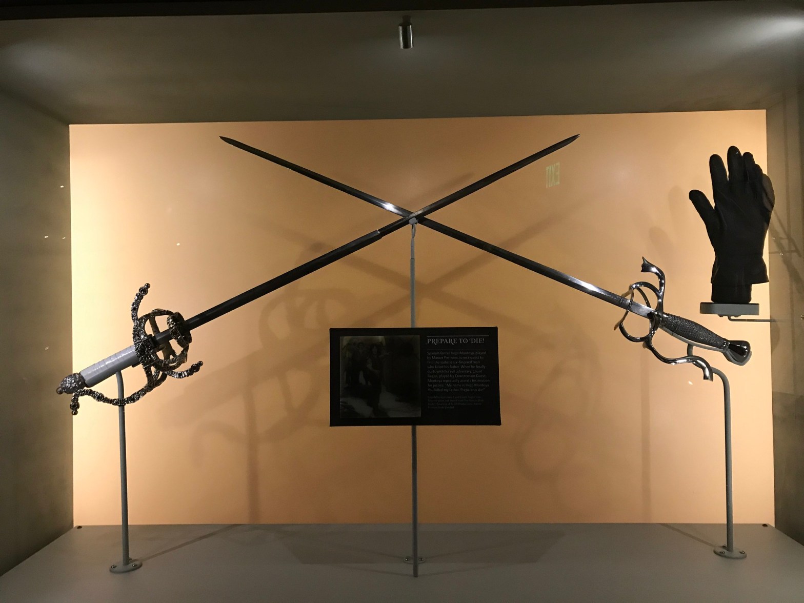 Photo of a display with Wesley and Inigo's swords from The Princess Bride.